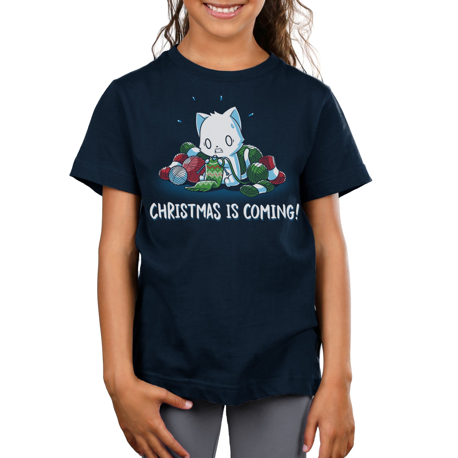 Premium Cotton T-shirt - Child wearing a super soft ringspun cotton navy blue apparelwith a graphic of a cat surrounded by yarn balls and the text "Christmas is Coming!" from monsterdigital.