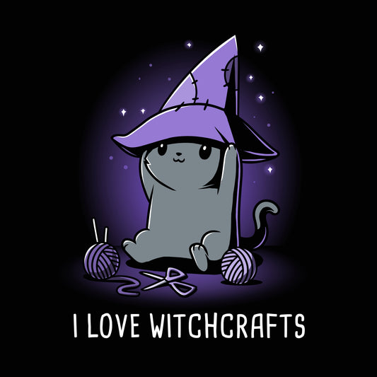 Premium Cotton T-shirt_TeeTurtle Crafty Kitty black t-shirt featuring a cheerful gray cat wearing a witches hat and crafting.