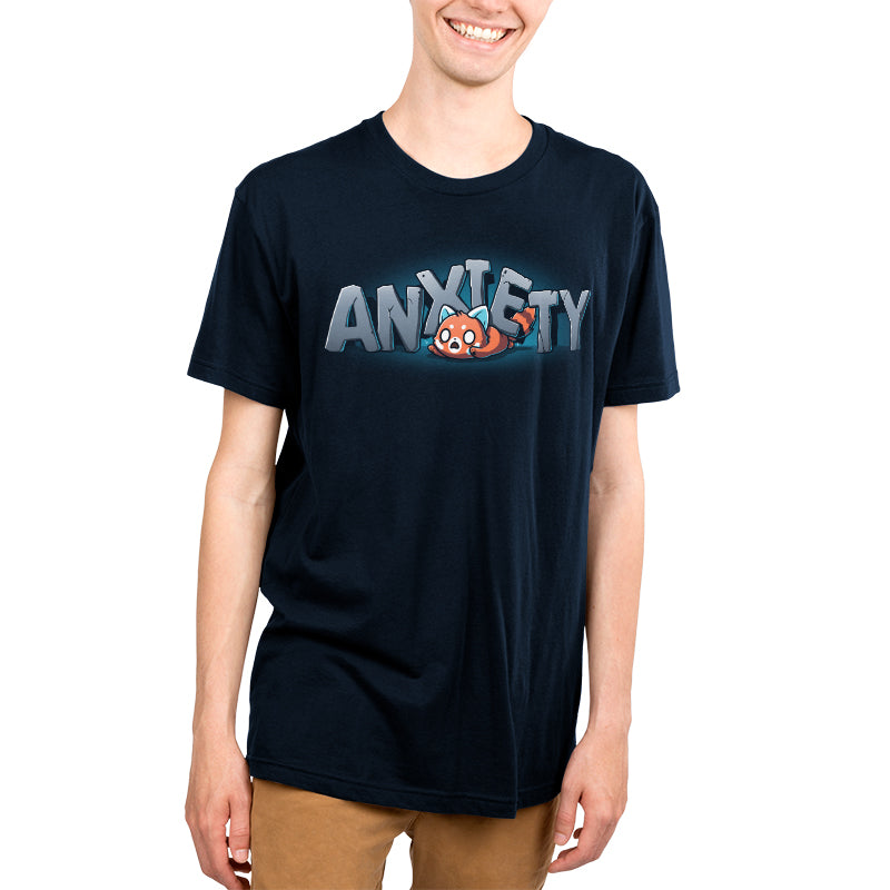 Premium Cotton T-shirt_TeeTurtle Crushing Anxiety navy blue t-shirt featuring an anxious red panda being squished under giant letters made of stone that spell "Anxiety" on top of his body. 