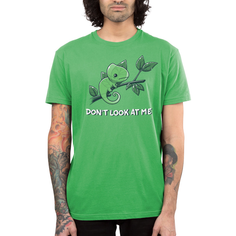 Premium Cotton T-shirt_Teeturtle Don't Look At Me apple green t-shirt featuring a little cartoon Chameleon trying to cloak itself against leaves while on a branch with 'Don't look at me.' written underneath the image.