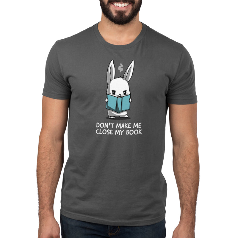 Premium Cotton T-shirt_TeeTurtle Don't Make Me Close My Book charcoal gray t-shirt featuring a rabbit holding a blue book and looking stern.