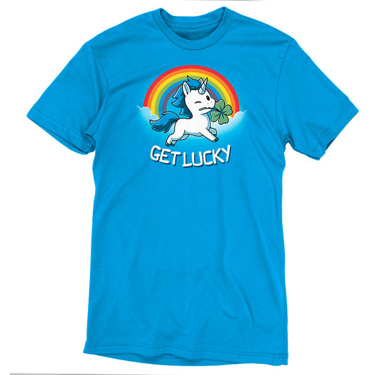 Premium Cotton T-shirt_Teeturtle Get Lucky cobalt blue t-shirt featuring a winking white unicorn holding a four-leaf clover while jumping through the clouds with a rainbow behind.
