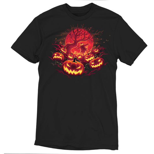 Premium Cotton T-shirt_TeeTurtle Haunted Pumpkin Patch black t-shirt featuring an illustration of glowing, orange-red jack-o-lanterns that show various expressions, such as mischievous grins and sinister scowls that surround a barren skeletal tree that reaches up out from the fiery full moon's edge.  A scarecrow with a jack-o-lantern head stands in the center of the image below the branches amongst the pumpkins.