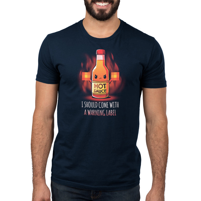 Premium Cotton T-shirt_TeeTurtle I Should Come With a Warning Label navy blue t-shirt featuring a bottle of hot sauce with an angry face, holding up two blurred out middle fingers. Text below reads, "I Should Come With a Warning Label."