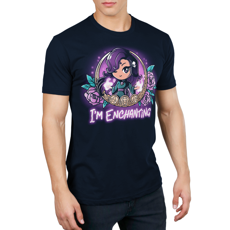 Premium Cotton T-shirt_TeeTurtle I'm Enchanting navy blue t-shirt featuring an illustration of a girl positioned within a gold-edged, ornate frame decorated with purple flowers and leaves winking her purple eyes with a white skull in her purple hair. "I'M ENCHANTING" is written underneath.