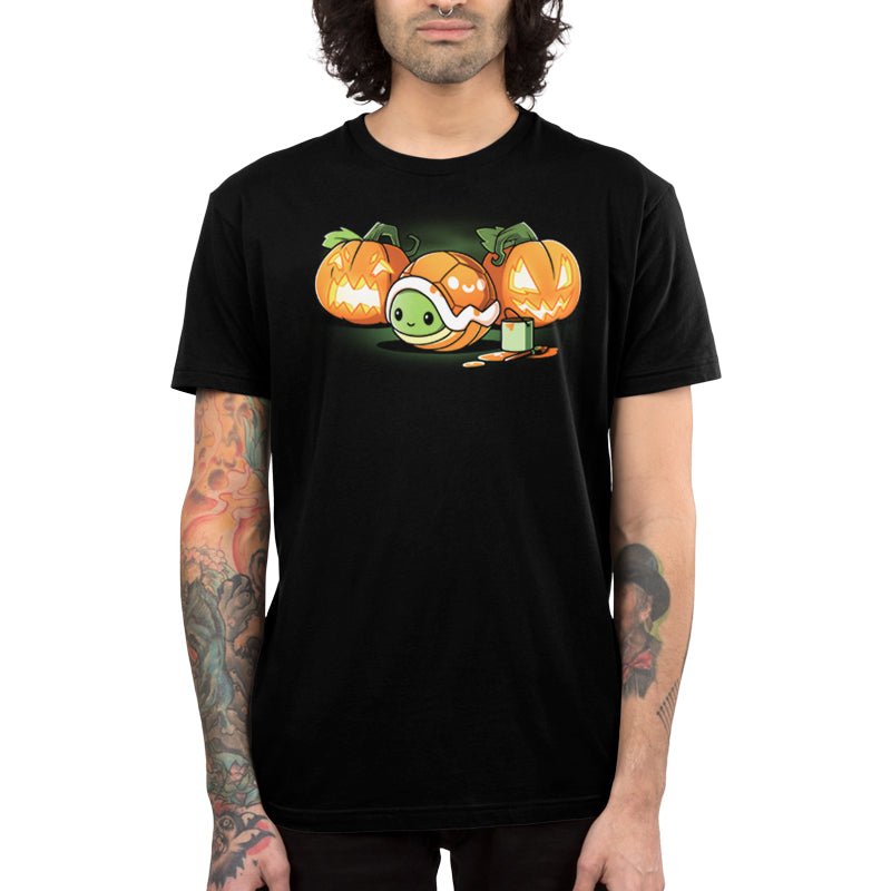 Premium Cotton T-shirt_Teeturtle Jack-o-Lantern Turtle black t-shirt featuring a small turtle is nestled inside an orange shell. It's surrounded by three carved pumpkins with glowing faces and a paint can with a brush.