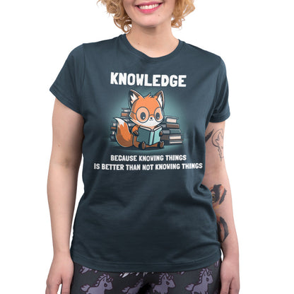 Premium Cotton T-shirt _TeeTurtle Knowing Things Denim Blue t-shirt featuring a fox wearing glasses, reading a book, with stacks of books behind it. 