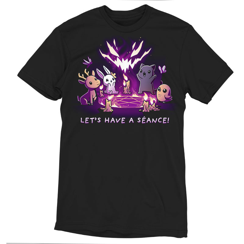 Premium Cotton T-shirt_TeeTurtle Let's Have a Séance! black t-shirt featuring an illustration of a deer, bunny, cat and owl having a séance on a pentagram surrounded by burning candles with "LET'S HAVE A SEANCE!" written underneath. A large, stylized, glowing, purple and white face hovers above the animals created by the flames.