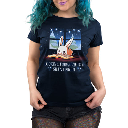 Premium Cotton T-shirt_TeeTurtle navy blue Looking Forward to a Silent Night. Featuring a reading bunny with a snowy forest outside.