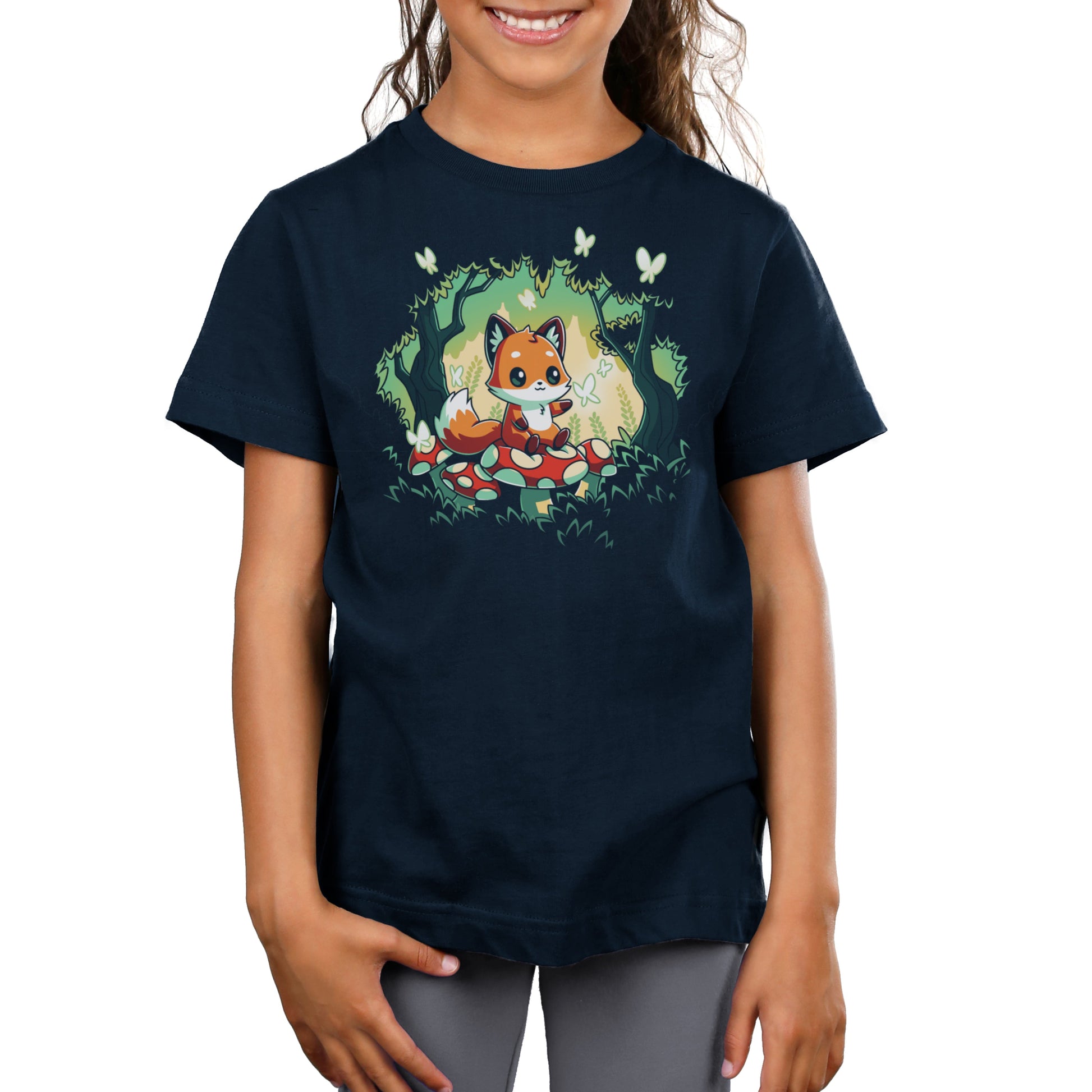 Premium Cotton T-shirt_TeeTurtle navy blue Magical Forest. Featuring a fox sitting on a toadstool in a forest with butterflies.