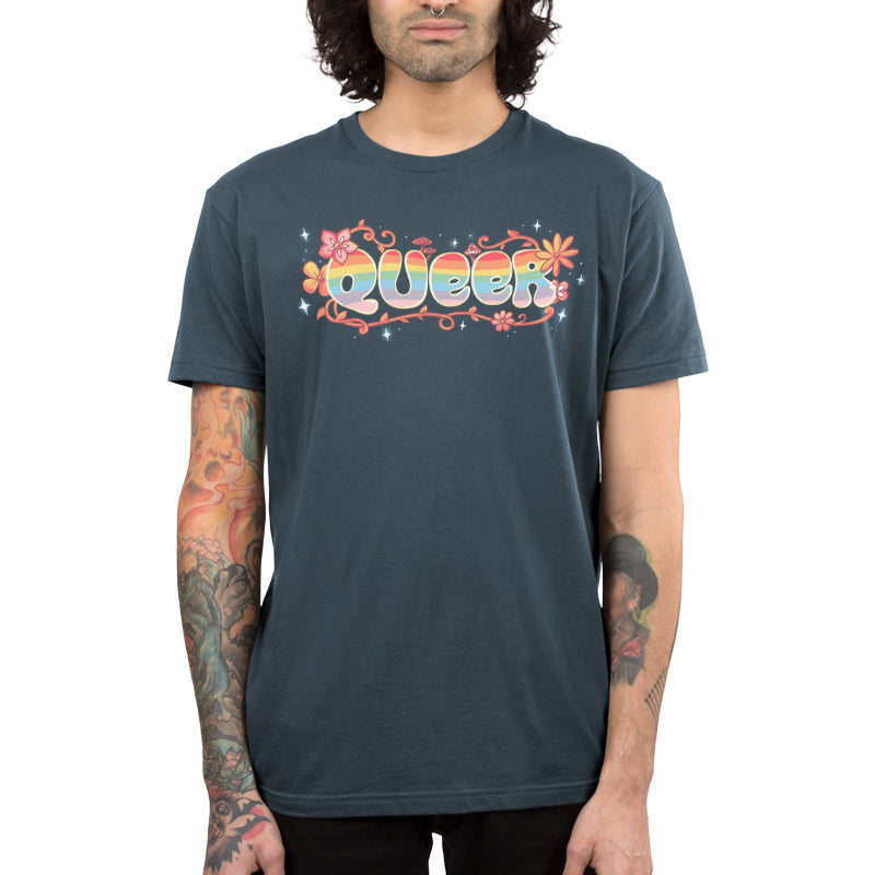 Premium Cotton T-shirt_TeeTurtle Queer denim blue t-shirt featuring an artistic "queer" word filled with rainbows and surrounded by flowers, vines, and mushrooms.