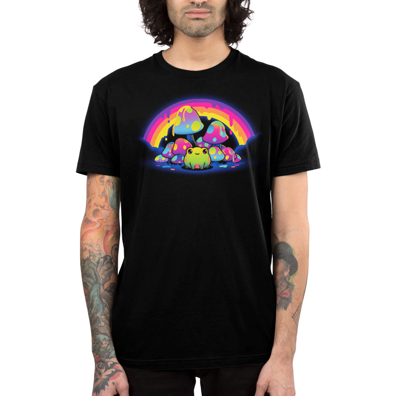 Premium Cotton T-shirt_TeeTurtle Rainbow Drip black t-shirt featuring a smiling frog sitting among colorful, spotted mushrooms with a dripping rainbow arching overhead.