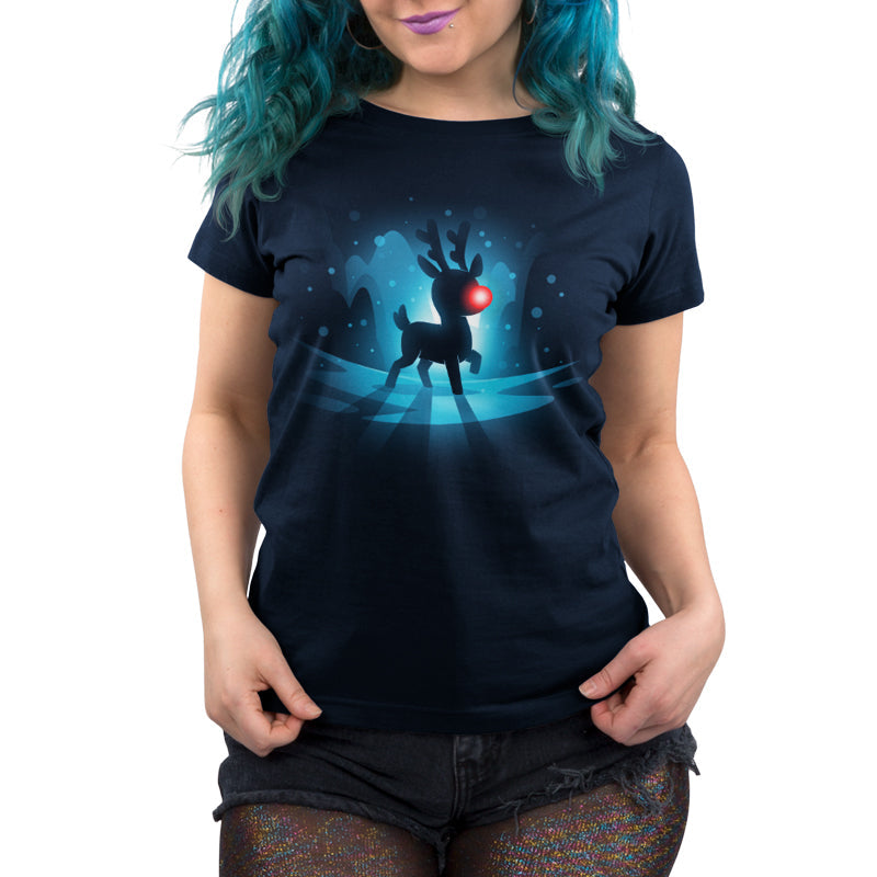 Premium Cotton T-shirt_TeeTurtle Red-Nosed Reindeer navy blue t-shirt featuring a silhouette of a reindeer with a glowing red nose, standing on a reflective surface with a blue, snowy Christmas background.