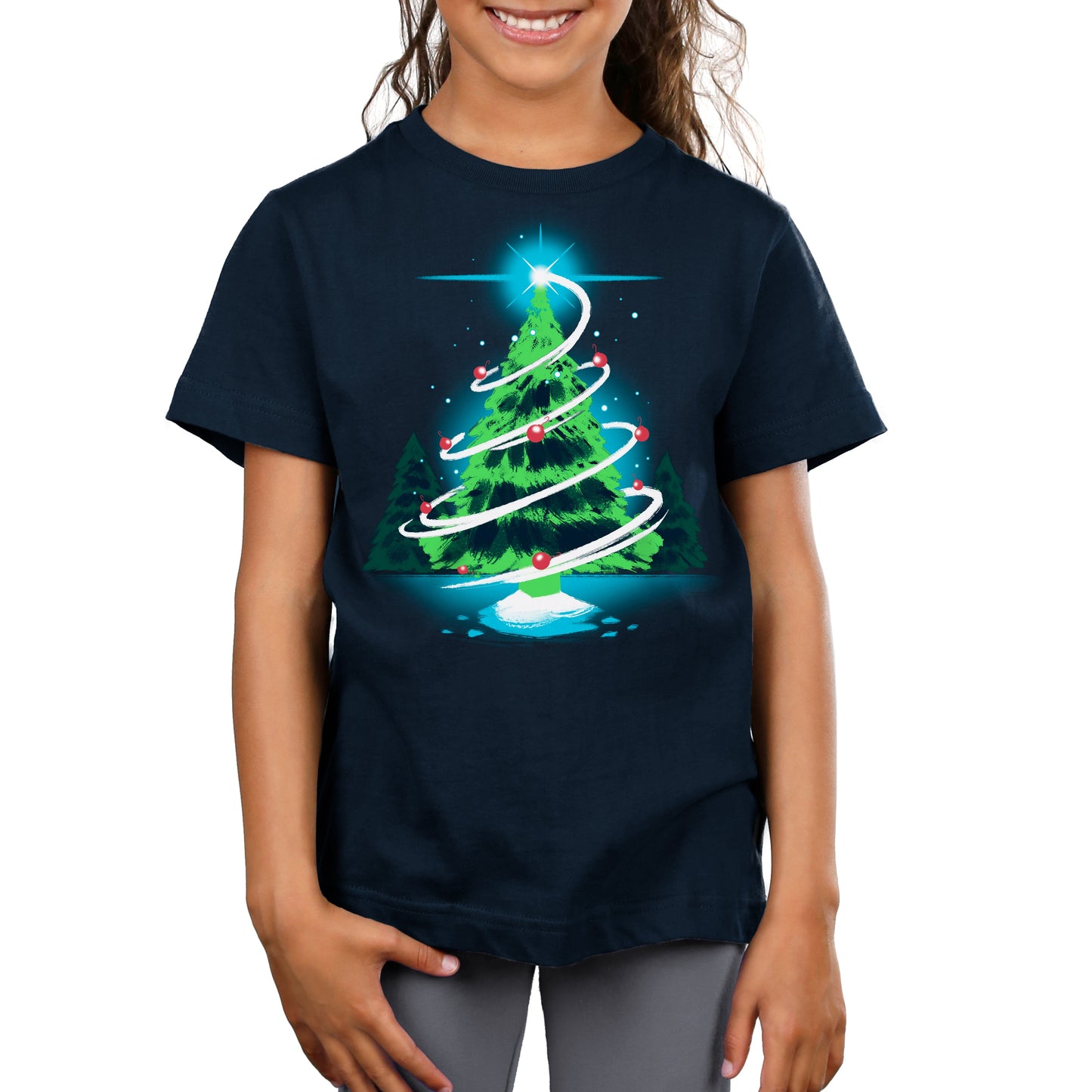 Premium Cotton T-shirt_TeeTurtle Christmas Tree navy blue t-shirt featuring a green tree in the forest with red ornaments with a white swirl around the tree and a winkling start right above it