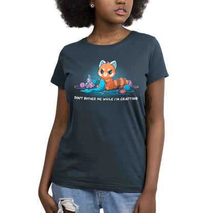 Premium Cotton T-shirt_TeeTurtle denim blue Don't Bother Me While I'm Crafting featuring an introverted, knitting red panda surrounded by knitting materials.