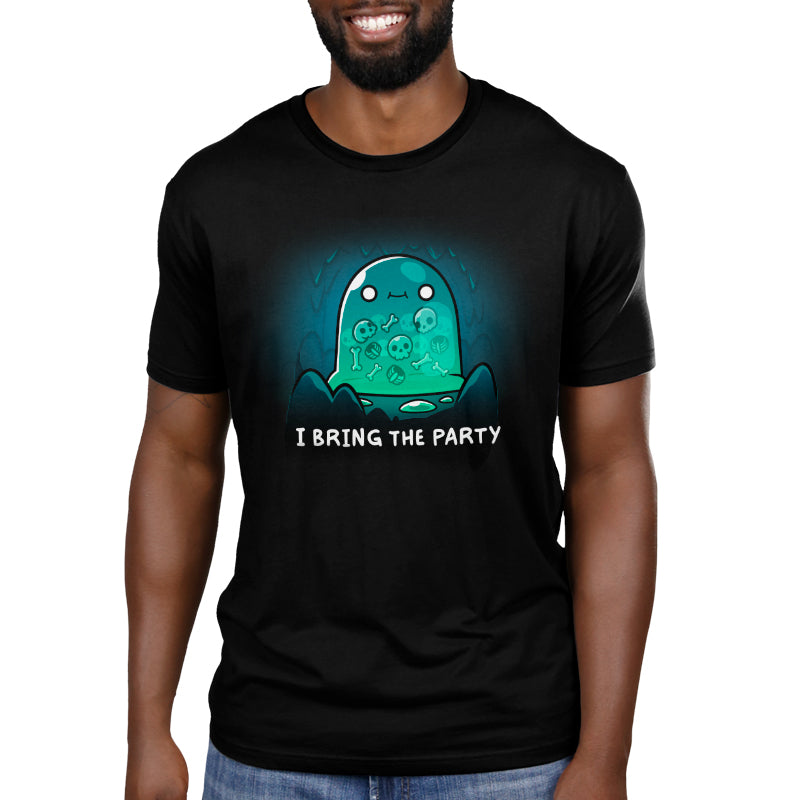 Premium Cotton T-shirt_TeeTurtle black I Bring the Party t-shirt featuring a giant slime monster with a small smile with multiple bones that can be seen in its transparent body inside a cave.