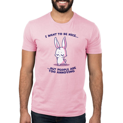 Premium Cotton T-shirt_Teeturtle I Want to Be Nice... light pink t-shirt featuring a cute bunny with closed eyes and folded ears standing with a shy expression. The text above and below says, "I want to be nice... but people are too annoying." 