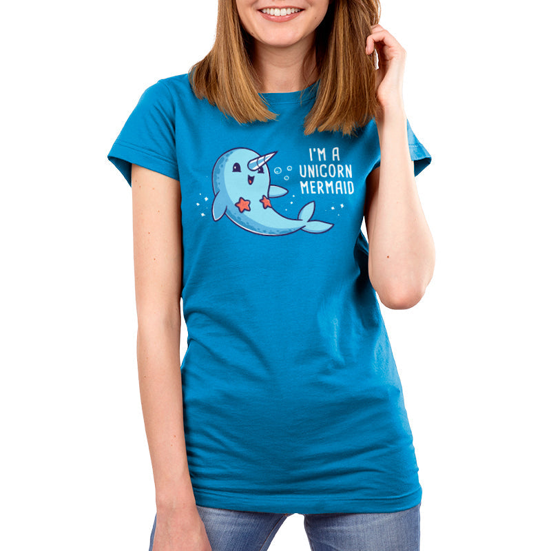 Teeturtle Cobalt Blue I'm a Unicorn Mermaid Premium Cotton T-shirt. Featuring a cute, smiling Narwhal wearing a pair of starfish on its chest while swimming in the ocean with sparkles and bubbles