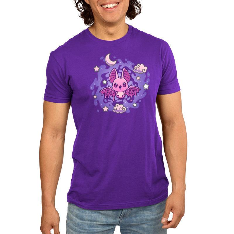 Premium Cotton T-shirt - A woman wearing a purple monsterdigital Itty Bitty Bat Women's apparel adorned with a cute pink bat, moon, and stars design on the front.