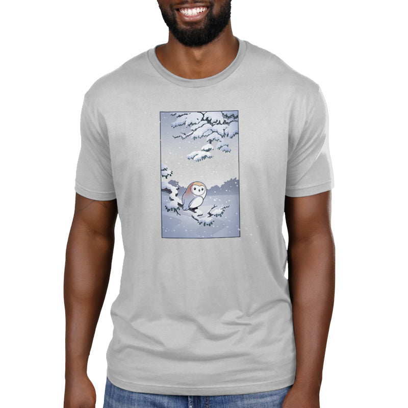 Premium Cotton T-shirt_TeeTurtle silver gray Snowy Owl apparel featuring a barn owl perched on a snowy branch with snow falling in the background.