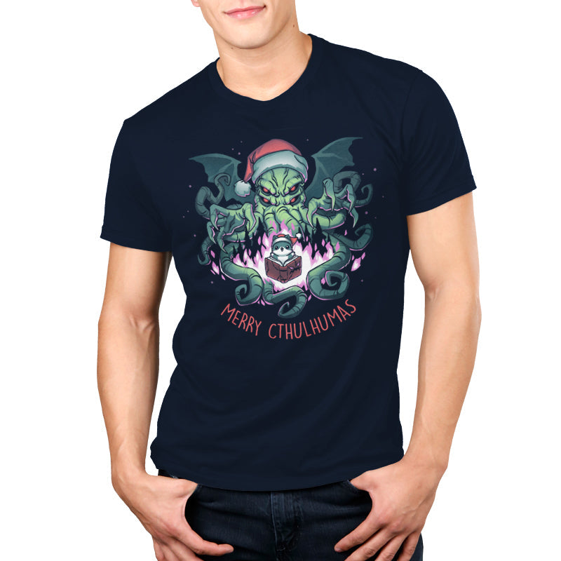 Premium Cotton T-shirt - featuring a big scary cthulhu showing its claws right above a cute little cat in a santa hat with a book open in front of it surrounded by purple fire