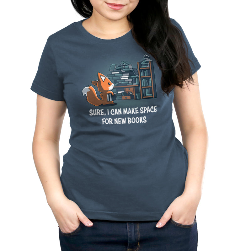 Premium Cotton T-shirt - A woman wearing a dark blue unisex apparelwith a cartoon fox and books, featuring the text "sure, i can make space for new Never-Ending Bookshelf by monsterdigital.