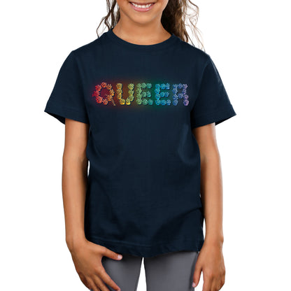 Premium Cotton T-shirt - A child wearing a super soft ringspun cotton navy blue apparel with the word "Queer and Proud" written in multicolored letters from monsterdigital.