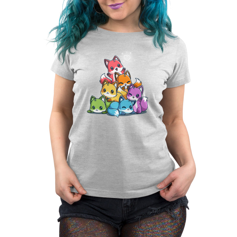 Premium Cotton T-shirt - A person with blue hair wearing a light gray, super soft ringspun cotton monsterdigital apparel featuring a colorful cartoon Rainbow Foxes design. The person is also wearing black shorts.