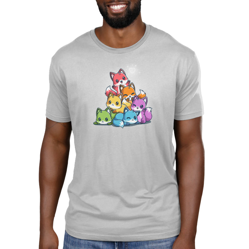 Premium Cotton T-shirt - Man wearing a light gray, super soft ringspun cotton apparel featuring a design of six colorful cartoon cat characters stacked in a pyramid. The apparel is the Rainbow Foxes by monsterdigital.