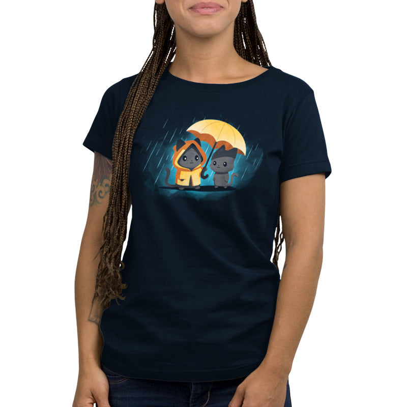 Premium Cotton T-shirt - A person wearing a navy blue unisex apparelwith an illustration of two cats, one in a hooded raincoat and the other holding an umbrella. The 100% super soft ringspun cotton fabric ensures maximum comfort. The apparelis called Sharing Kindness by monsterdigital.