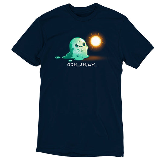 Premium Cotton T-shirt_TeeTurtle Shiny Distraction navy blue t-shirt featuring a slime creature staring in awe at a glowing, golden orb.
