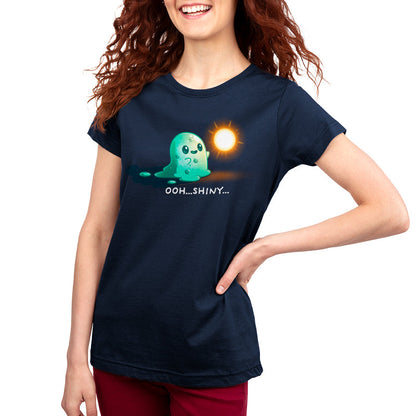 Premium Cotton T-shirt_TeeTurtle Shiny Distraction navy blue t-shirt featuring a slime creature staring in awe at a glowing, golden orb.
