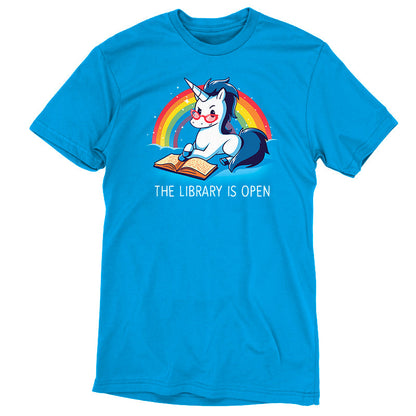 Premium Cotton T-shirt_TeeTurtle The Library is Open cobalt blue t-shirt featuring a unicorn with glasses reading a book against a rainbow backdrop.