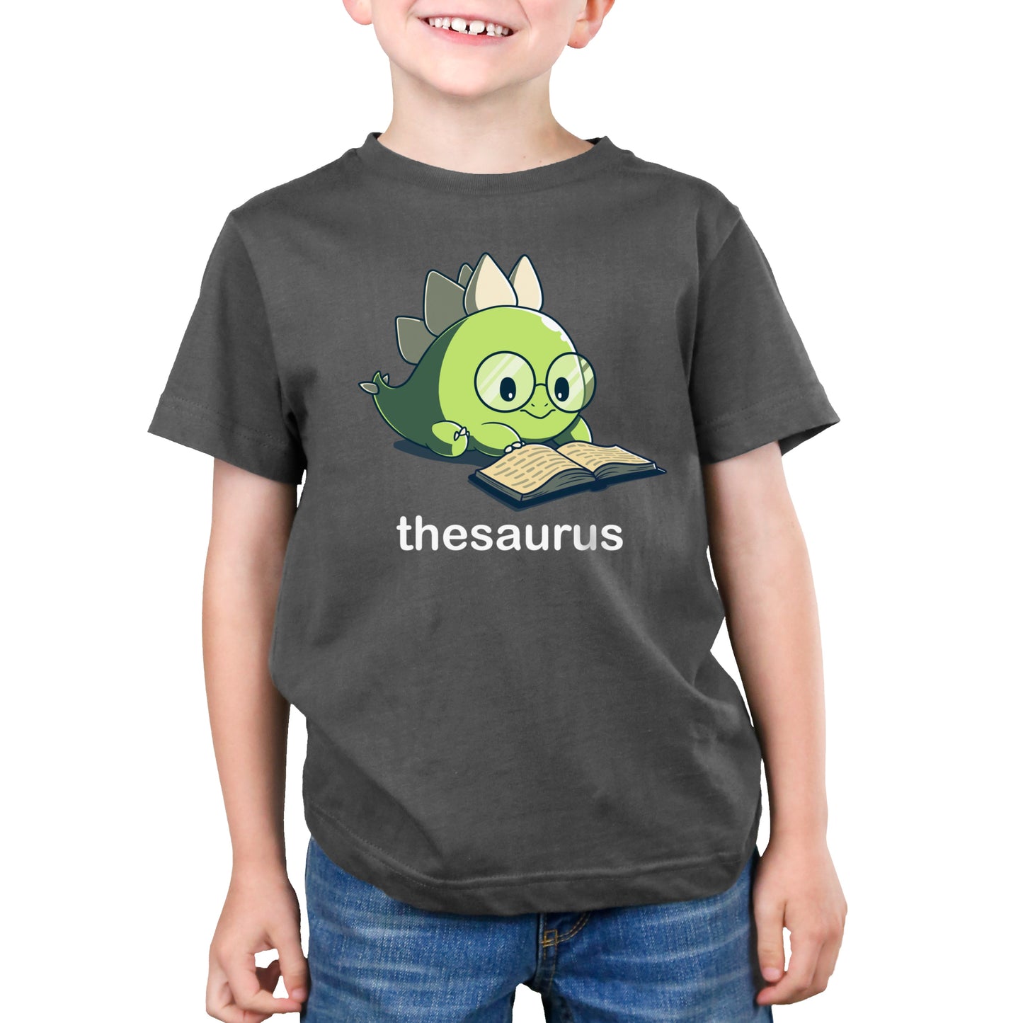 Premium Cotton T-shirt_Teeturtle Thesaurus charcoal gray t-shirt featuring a cute green dinosaur with glasses reading an open book. Below it, the word "thesaurus" is written.