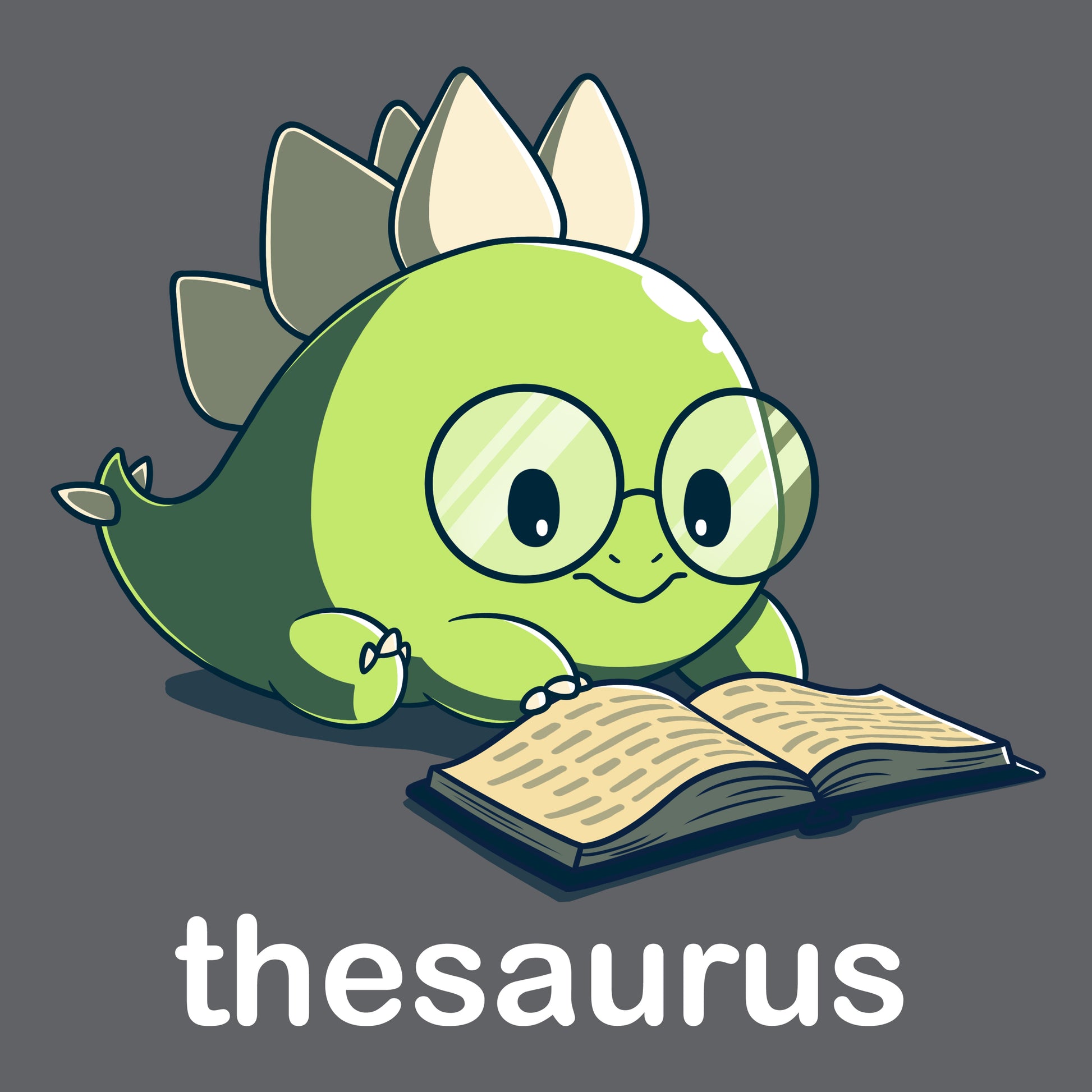 Premium Cotton T-shirt_Teeturtle Thesaurus charcoal gray t-shirt featuring a cute green dinosaur with glasses reading an open book. Below it, the word "thesaurus" is written.