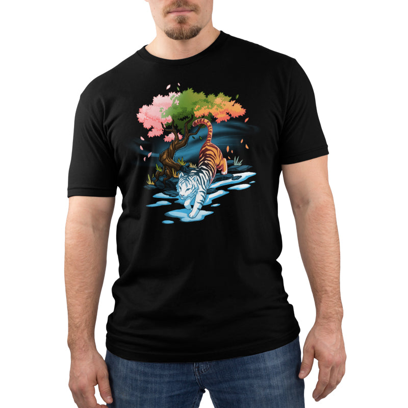 Premium Cotton T-shirt_TeeTurtle Season Keeper black t-shirt featuring a majestic tiger walking below a magical tree that has leaves the color of three seasons.