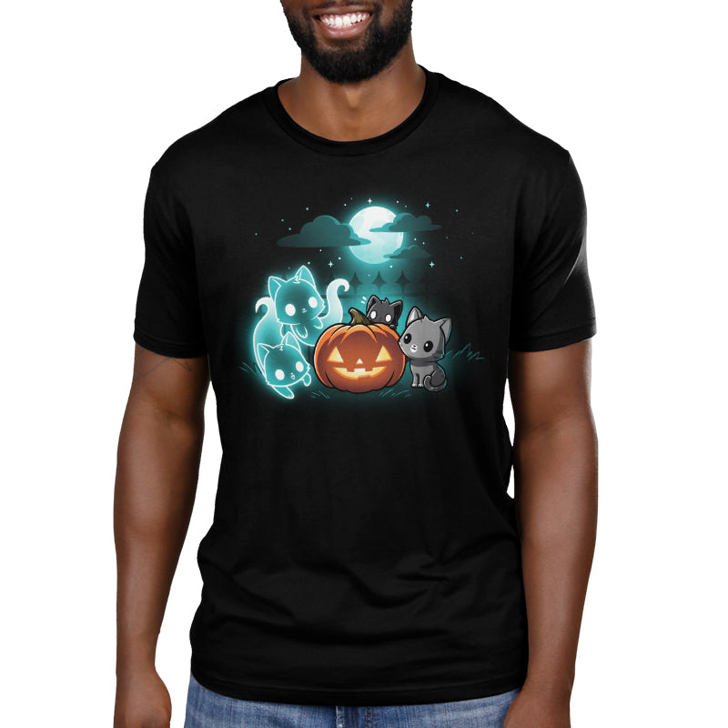 Premium Cotton T-shirt_TeeTurtle Spurrits of Halloween black t-shirt featuring two dark and dangerous ghost cats next to two grey cats watching them. They are surrounding a jack-o-lantern and there is a full moon with clouds behind them.