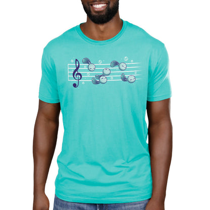 Premium Cotton T-shirt_Teeturtle Tadpool Tune caribbean blue t-shirt featuring a gaggle of adorable cartoon tadpoles swimming along a music score.