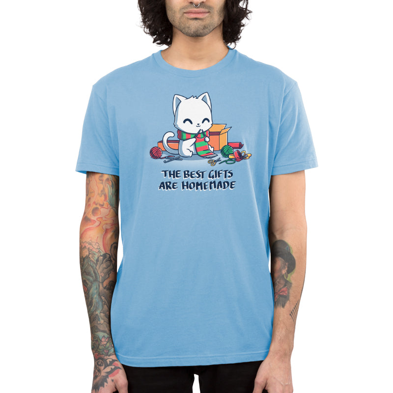 Premium Cotton T-shirt - featuring a smiley white cat surrounded by craft supplies, knitting a green and red stripped scarf