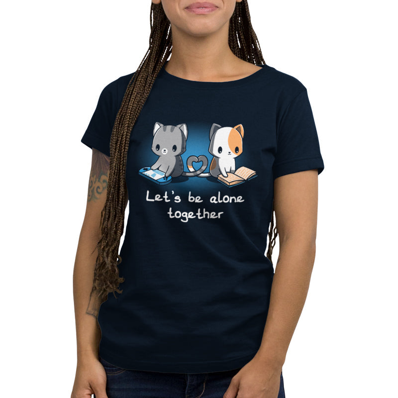 Premium Cotton T-shirt_Two cartoon cats, one gray playing a handheld game and the other orange and white reading a book, sit with their tails forming a heart shape. On this navy blue apparel made from 100% super soft ringspun cotton, the text reads, "Let's Be Alone Together." This delightful design is from monsterdigital's "Let's Be Alone Together" collection.