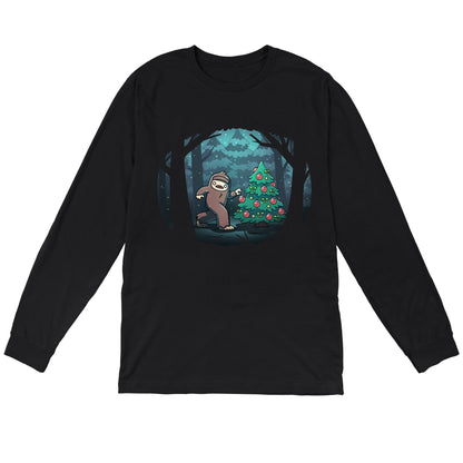 Long Sleeve T-shirt_TeeTurtle black Bigfoot Christmas apparel featuring a sasquatch caught putting holiday decor on a tree in the middle of a snowy forest.