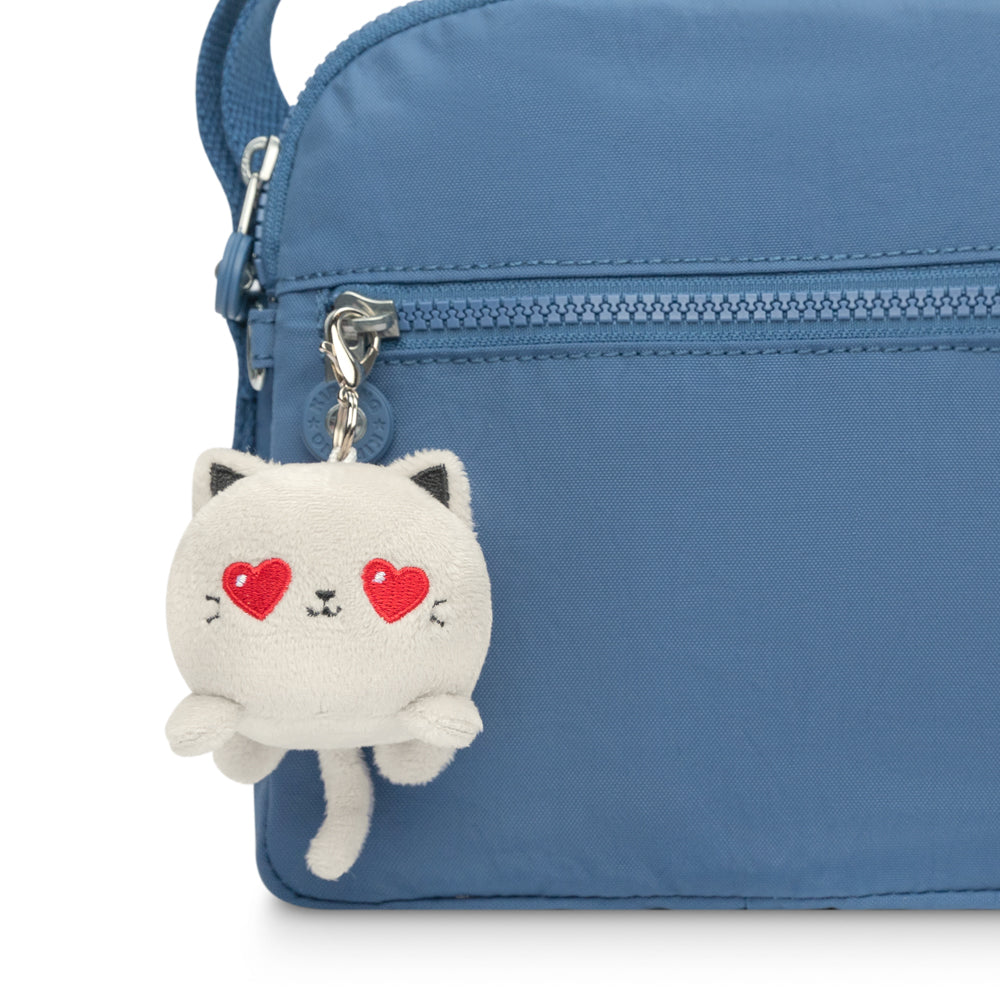 A portable bag with a Cat Plushie Charm Keychain by TeeTurtle attached to it.