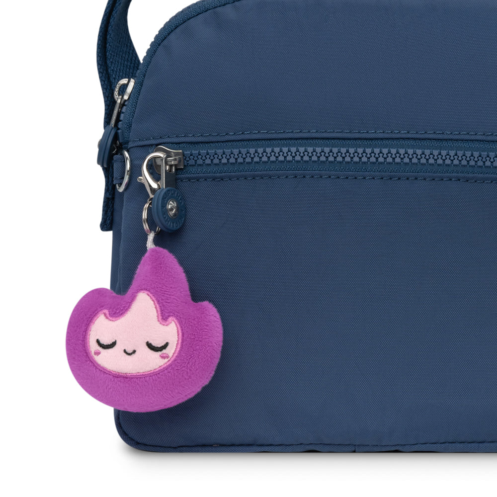 A portable backpack with a Flame Plushie Charm Keychain from TeeTurtle.