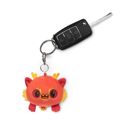 A Lunar New Year Dragon plushie charm keychain featuring a cute stuffed animal by TeeTurtle.