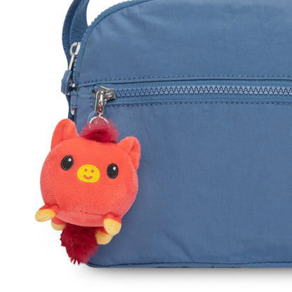 A blue bag with the Lunar New Year Horse Plushie Charm Keychain, part of the TeeTurtle Lunar New Year collection.