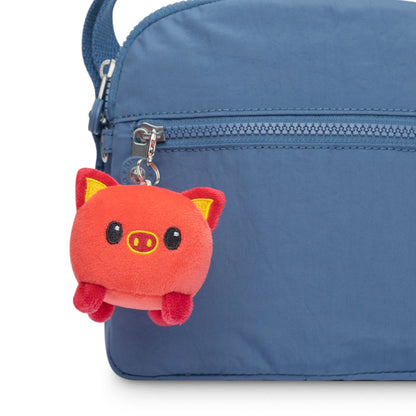 A Lunar New Year themed blue bag with a TeeTurtle Lunar New Year Pig Plushie Charm Keychain.