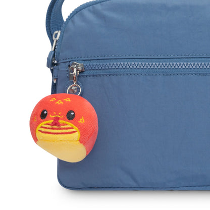 A blue bag with a Lunar New Year Snake Plushie Charm Keychain by TeeTurtle attached to it.