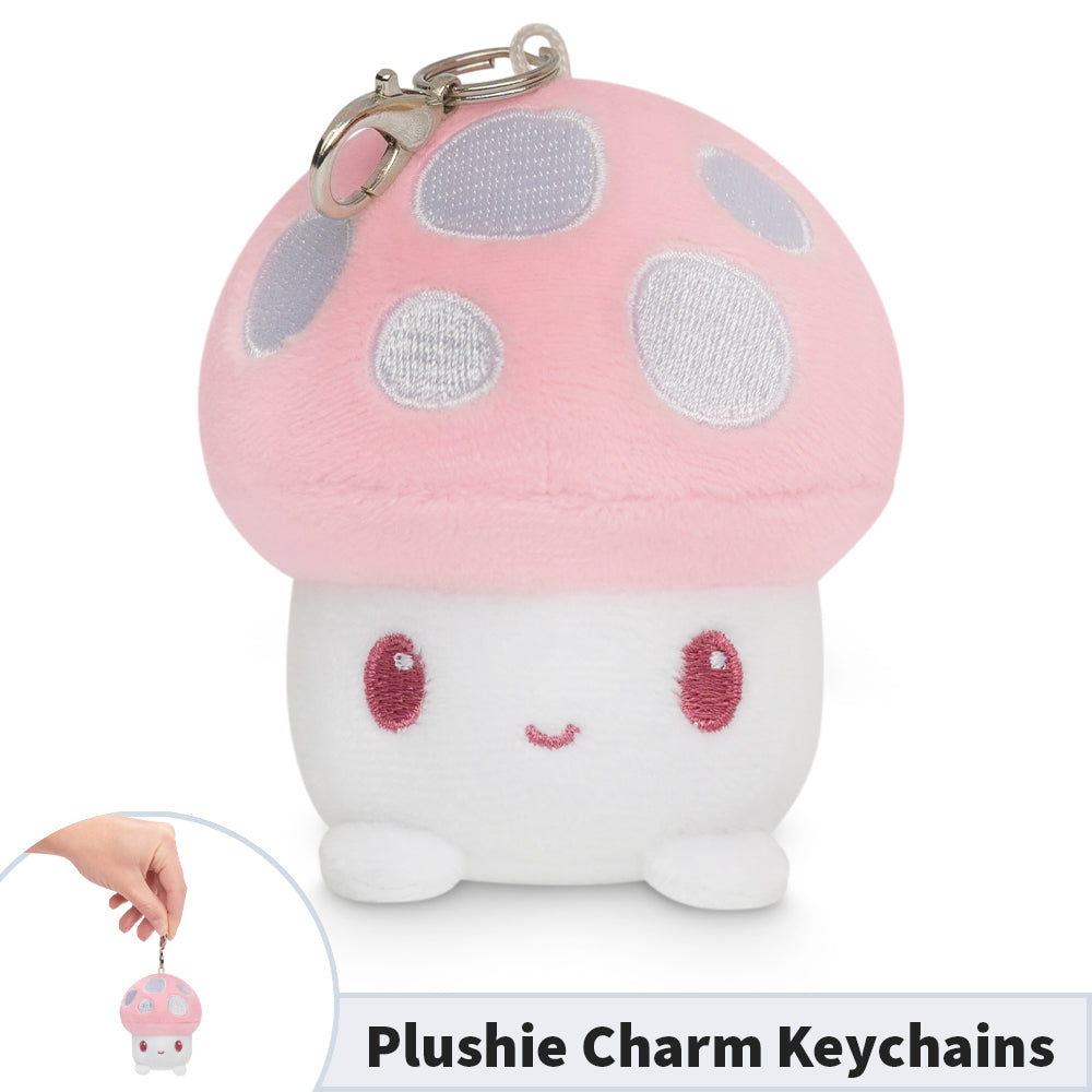 A Mushroom Plushie Charm Keychain shaped like a pink mushroom by TeeTurtle.