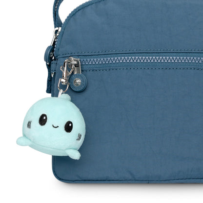 A portable Shark Plushie Charm Keychain featuring a small shark plushie that can clip onto bags from TeeTurtle.