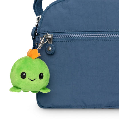 A blue purse with a Stego Plushie Charm Keychain.